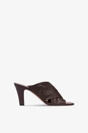 Mules in ebony leather