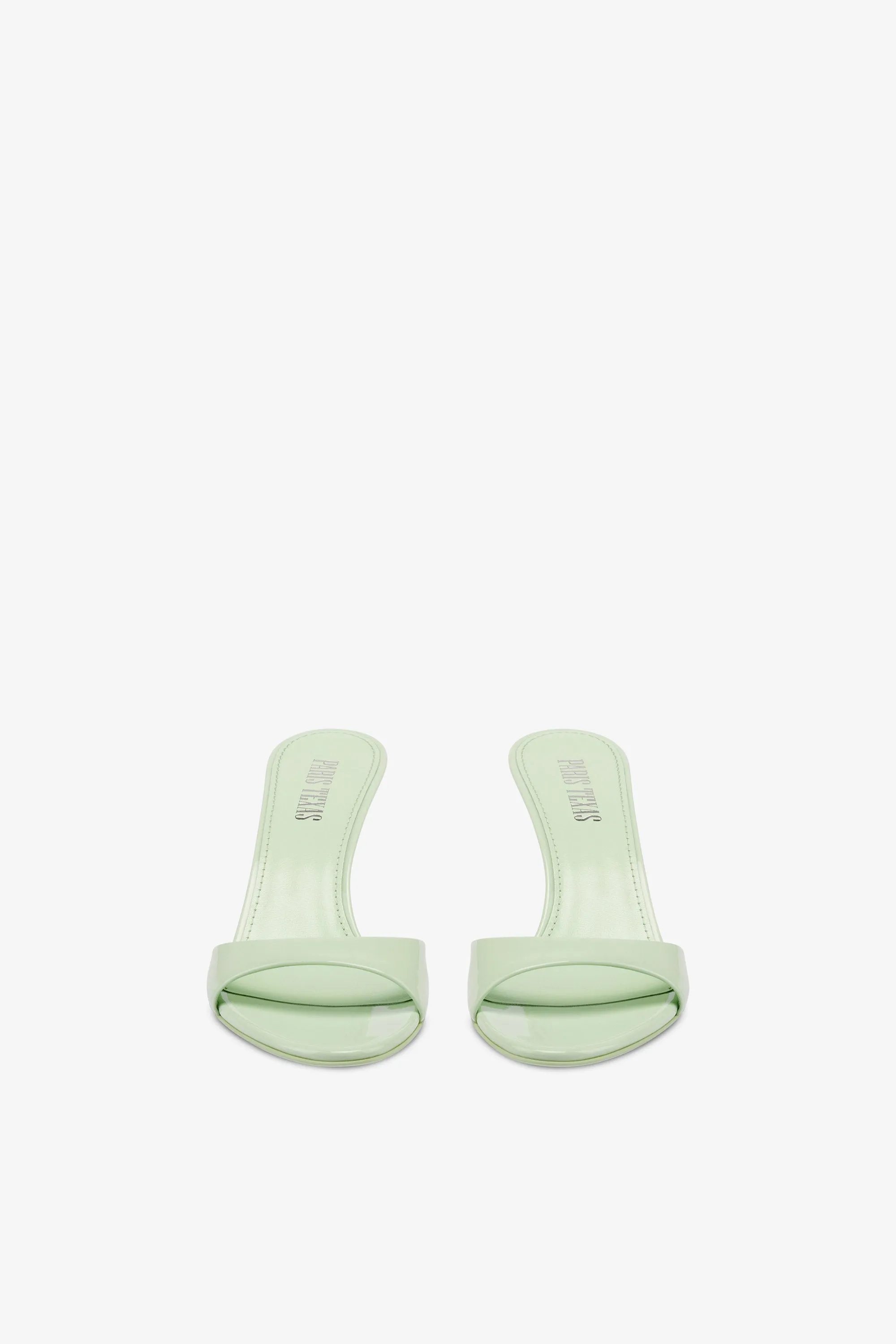 Mules in mint patent leather