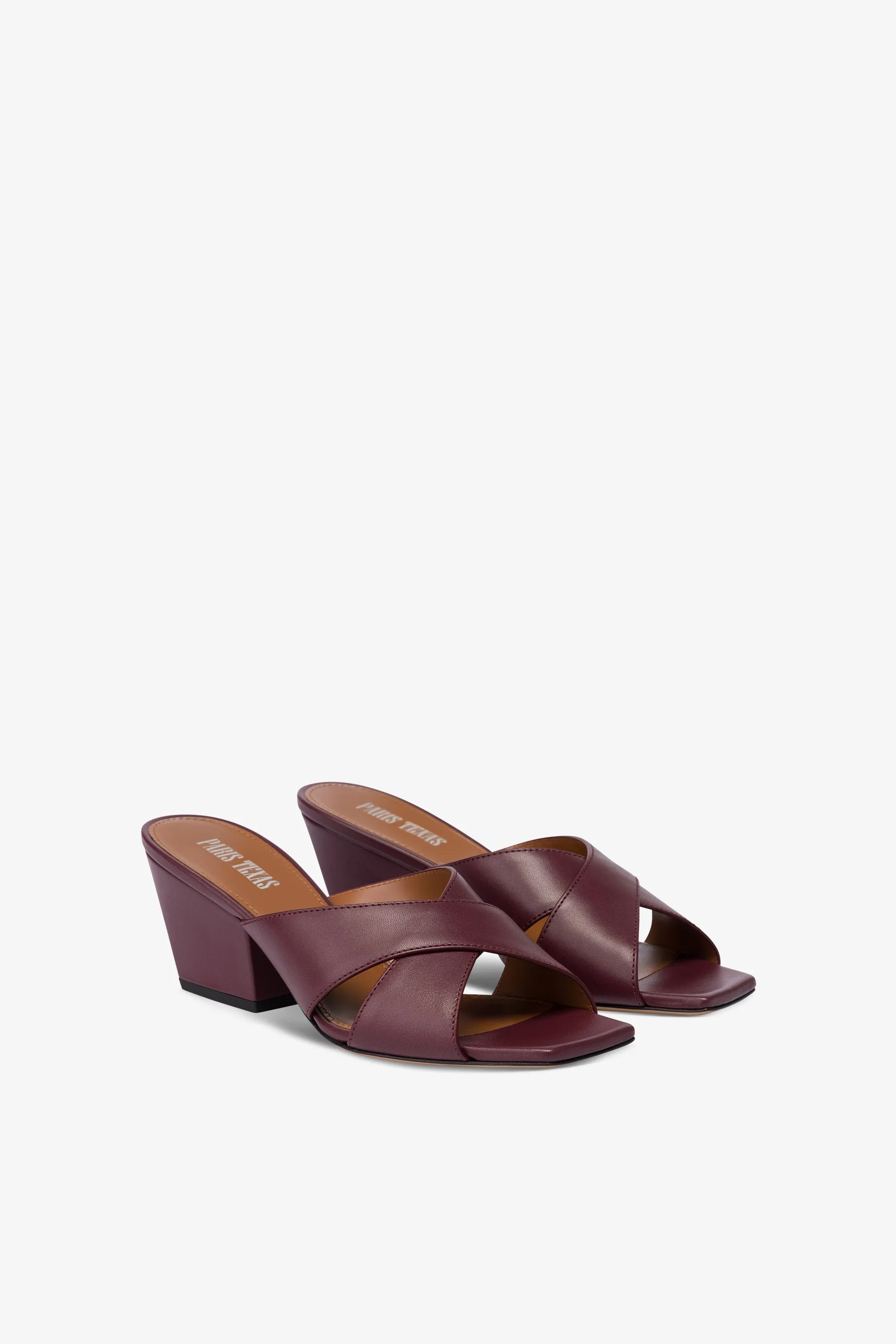 Mules in rouge noir leather