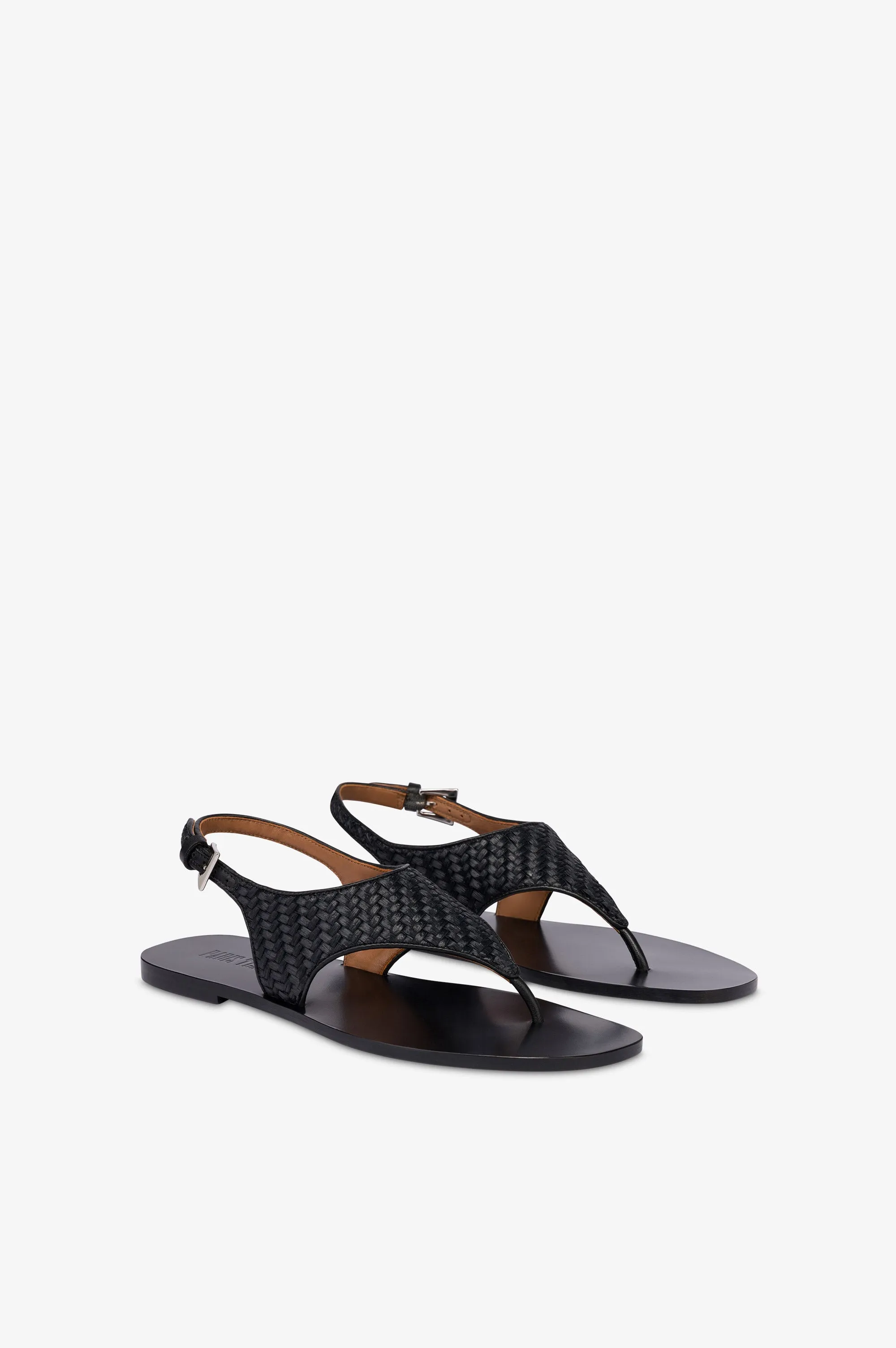 Sandals in natural raffia and black leather